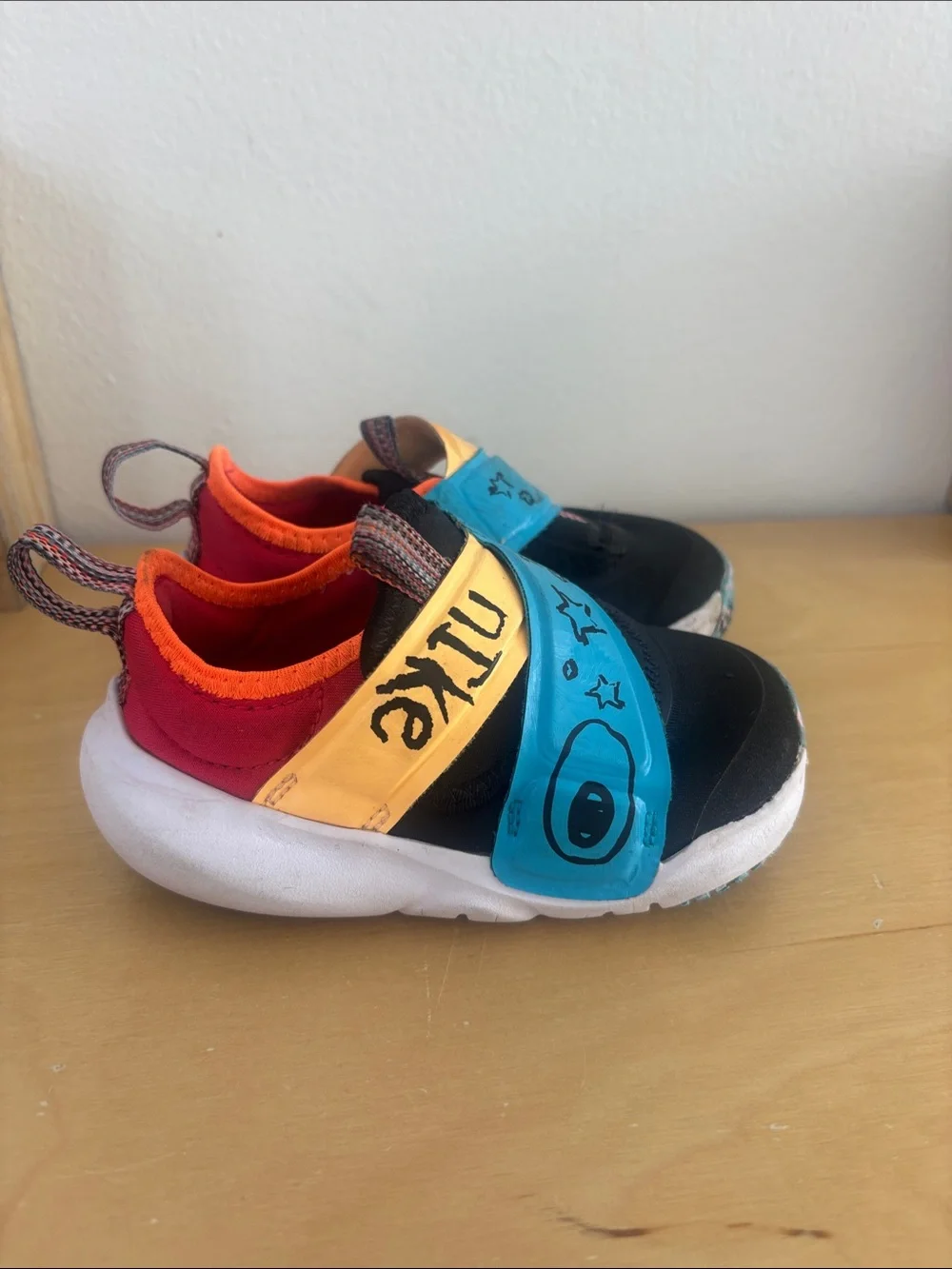 Nike Kids Black, Blue, Yellow and Red Slip-On Sneakers
